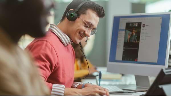 A man talk to someone on a video conference call
