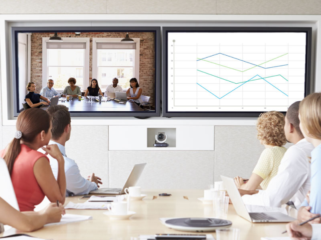 Group in conference room looking at whiteboard