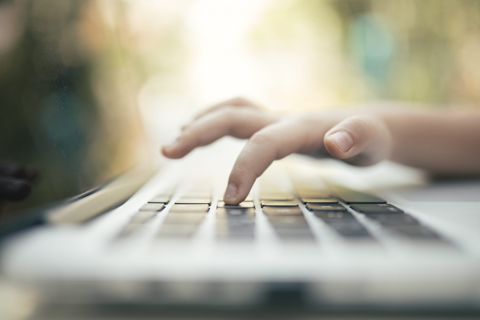 hand typing on computer keyboard