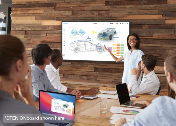 Office workers focused on whiteboard