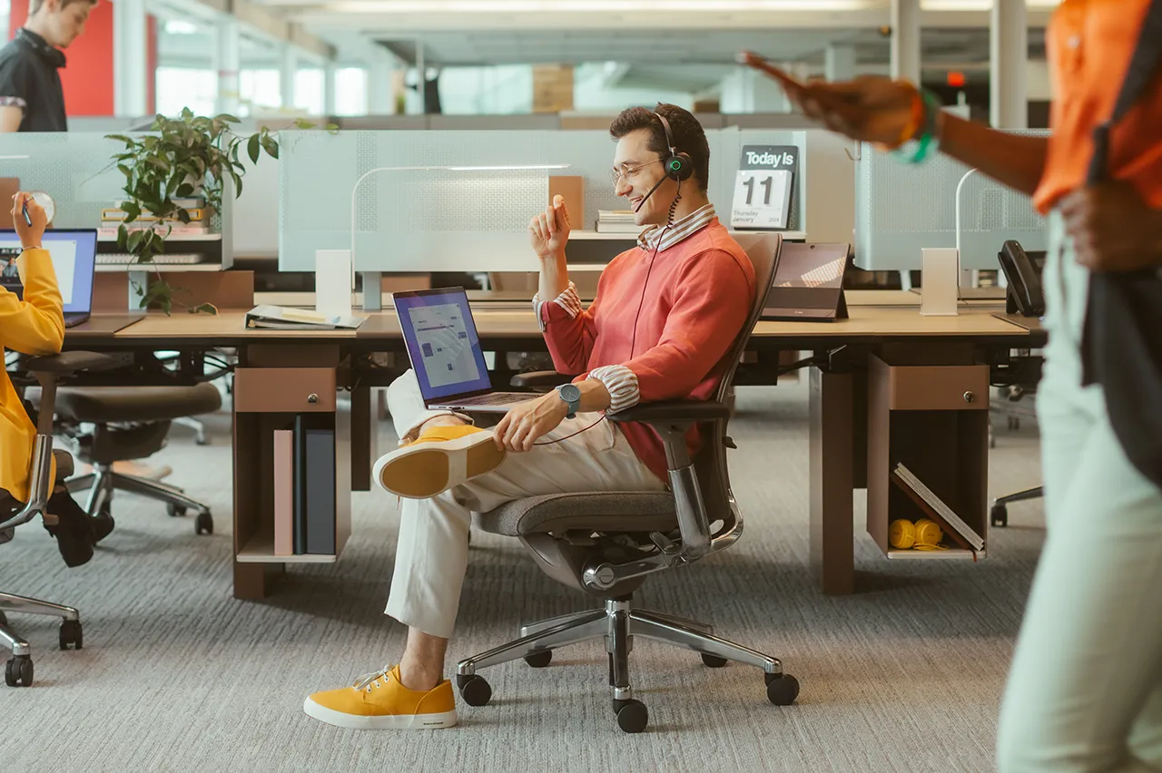 Photo of call center agents working together at a work station