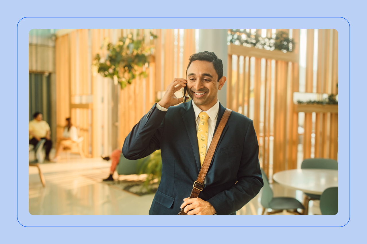 A happy man on the phone with a contact center agent