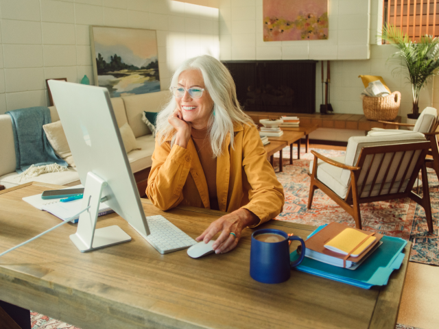 Woman in office at computer desk