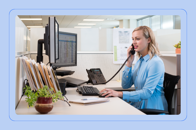 Call center agent speaking with client via computer telephony