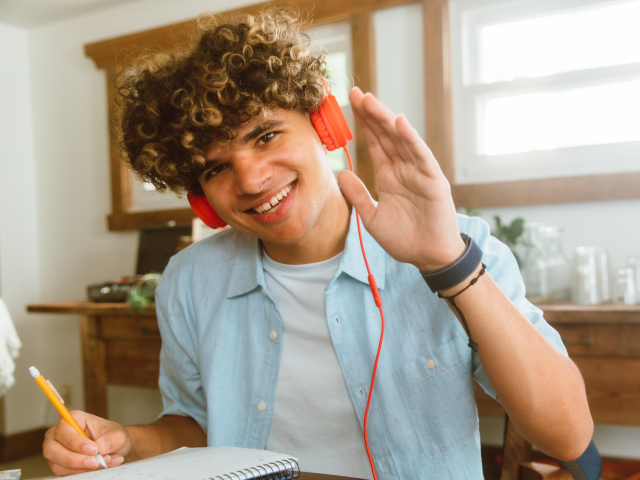 Student waving