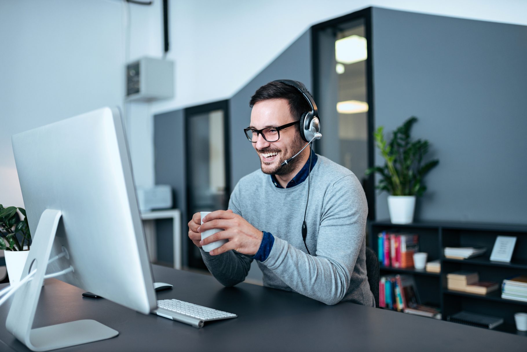Man working at desk with coffee