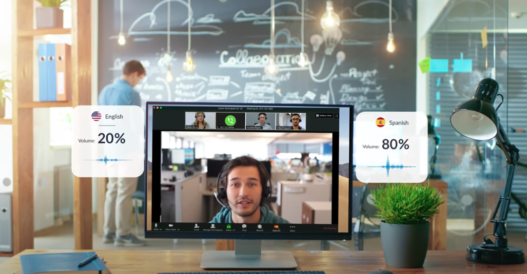 Computer screen with man speaking in a ZOom video webinar. Graphics showing Spanish interpreter's volume and English speaker's volume.