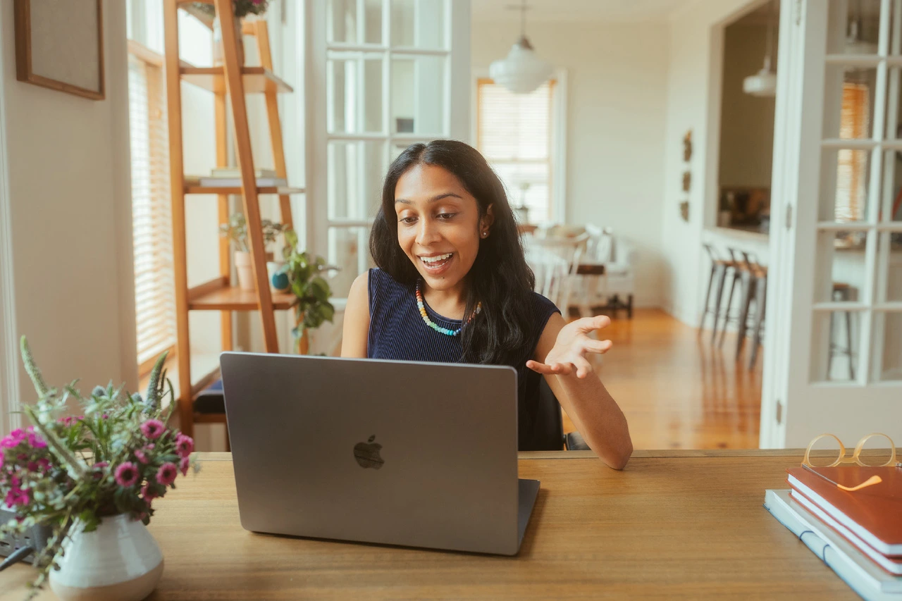 A woman on a video call via her laptop.