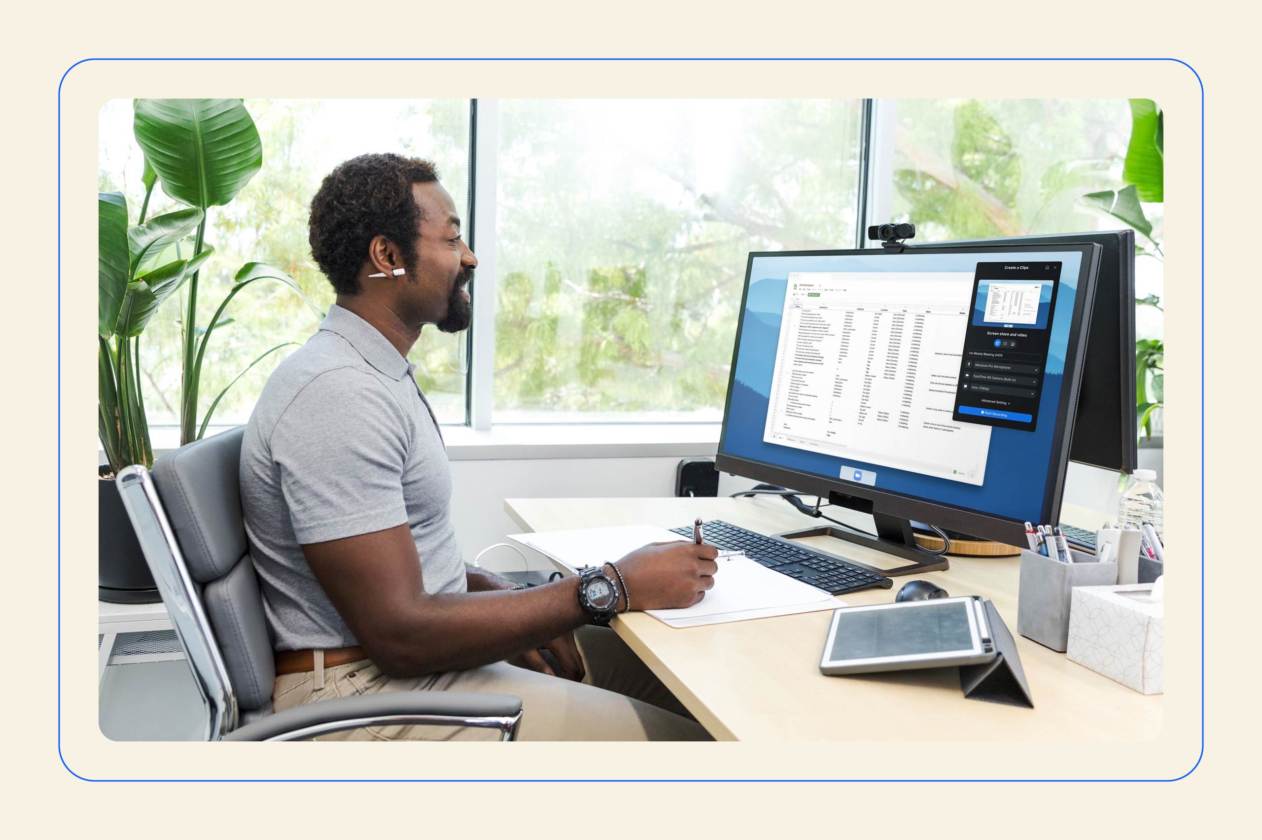 A man at a desk using Zoom Chat to talk to his colleagues