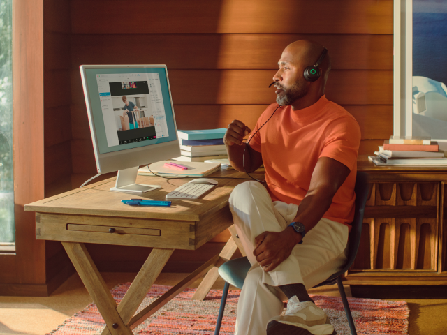 Man sitting at desk on zoom meetings