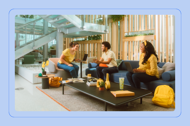 A team collaborating on a project in a break area of an office