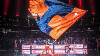 University of Illinois flag being waved