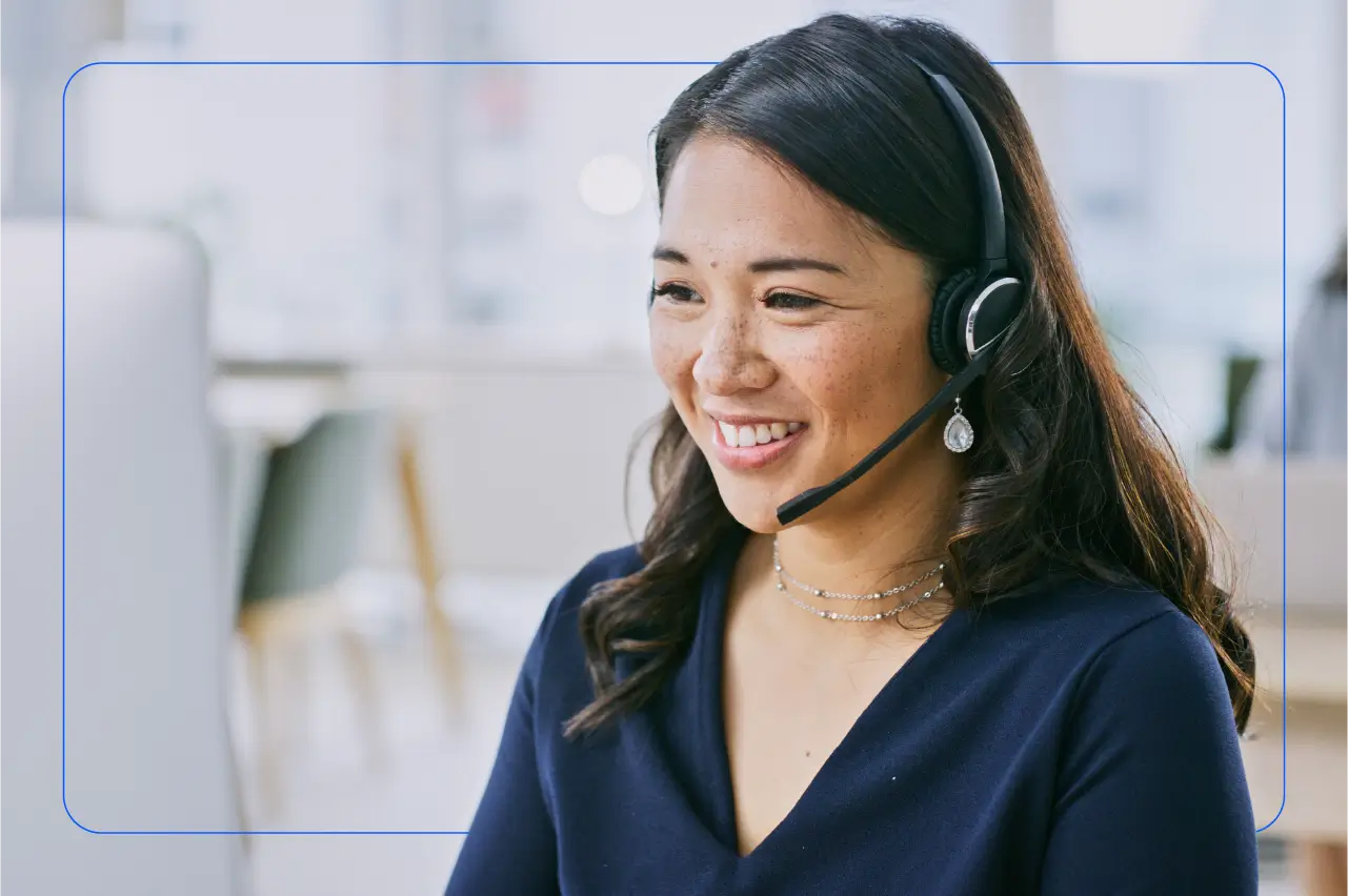 Photo of an agent at a contact center on a call